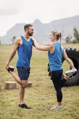 Wall Mural - Fit people performing stretching exercise