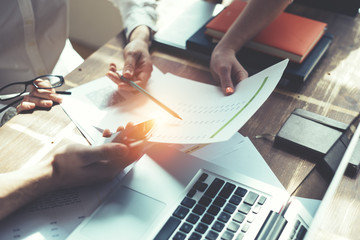 Fototapete - Business people working together. Loft office and smart casual dress code. Researching new product strategy. Electronic devices and paperwork. Intentional sun glare effect