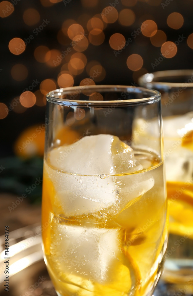 Glass with delicious wine spritzer on dark background