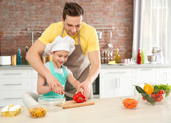 Wall Mural - Dad and son cooking at home