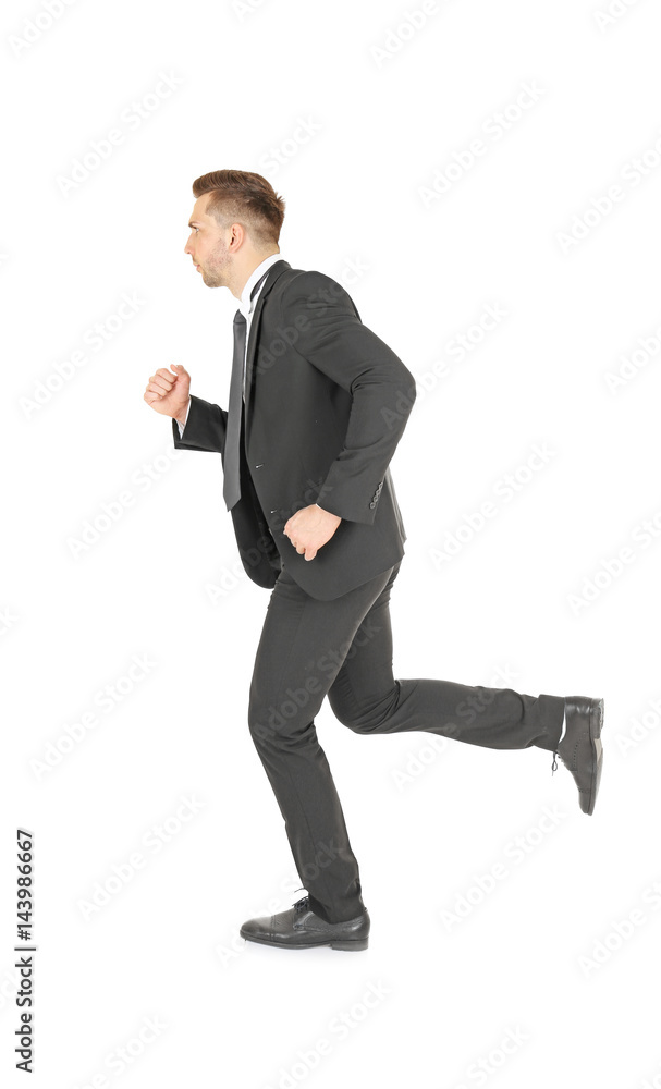 Handsome running businessman on white background