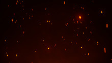 Firestorm Texture. Bokeh Lights On Black Background, Shot Of Flying Fire Sparks In The Air