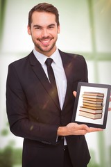 Sticker - Composite image of smiling businessman showing his tablet pc