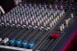 © haoka - Sound mixer. Professional audio mixing console with lights, buttons, faders and sliders.