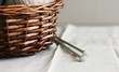 Brown wooden basket with knitting needles