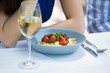 © WavebreakMediaMicro - Cropped image of couple with food and wineglass on table