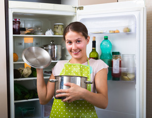 Canvas Print - Happy woman near fridge.