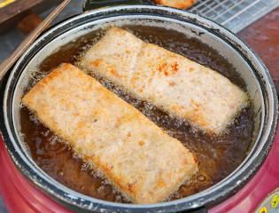 Fried pork in a pan