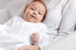 © fotofabrika - Young mother and newborn baby in white bedroom