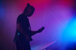 © Voloshyn Roman - Guitarist performing on stage. Concert.