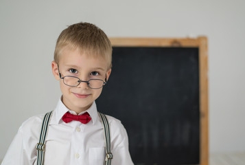 The boy near blackboard