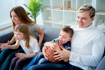 Family watching basketball