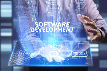 Business, Technology, Internet and network concept. Young businessman working on a virtual screen of the future and sees the inscription: Software development