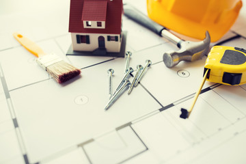 Sticker - close up of house blueprint with building tools