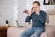 © zinkevych - Senior man sitting with headache