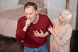 © zinkevych - Aged man coughing near his wife