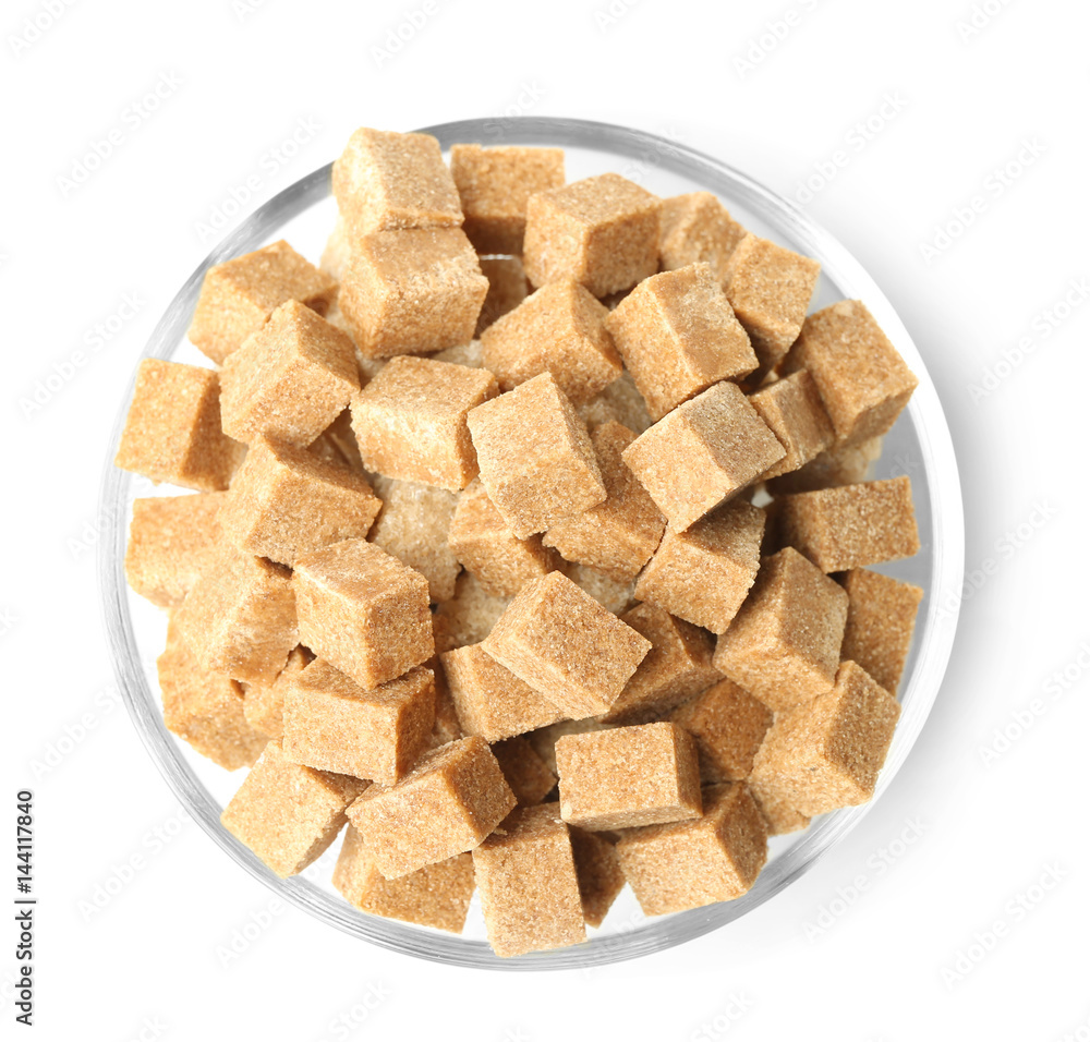 Heap of brown sugar in bowl, isolated on white