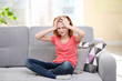 © Africa Studio - Cute girl suffering from headache at home