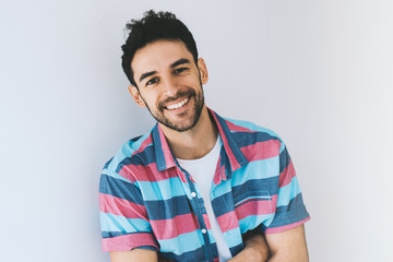 Close up portrait of handsome smart-looking smiling caucasian male model posing for social advertisement, isolated on white background with copy space for your promotional information or content.