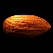 Almond Isolated On Black Background With Reflection. Close-up Or Macro. Health Concept