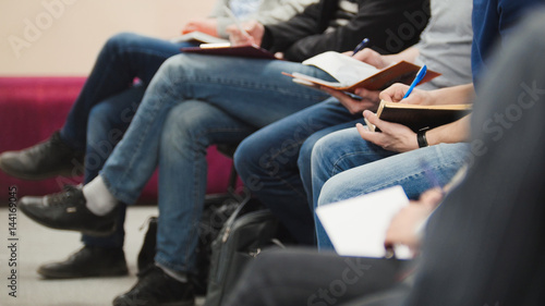 Photo  Pupils and students - listening at conference or presentation, workshop, master