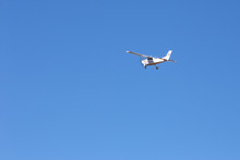 Small Plane In Clear Blue Sky