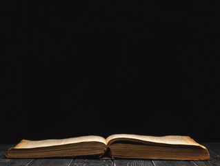 Open book on a black background
