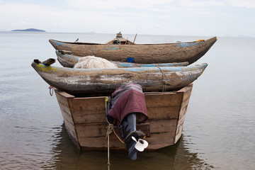 A fishing boat rests near the shore of Lake Malawi