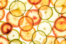 Bright Lime And Orange Slices On White