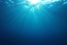 Underwater Blue Ocean Background With Sunlight 