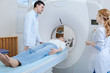 © zinkevych - Positive experienced doctor doing brain tomography