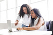 © Louis-Paul Photo - Two teen at desk in her office with laptop