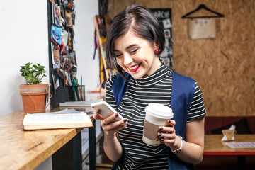 Smiling pretty girl with cup of coffee