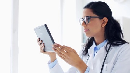 Sticker - female doctor with tablet pc at hospital