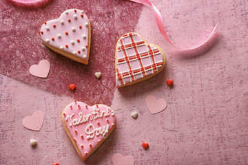 Wall Mural - Heart shaped glazed cookies on color background