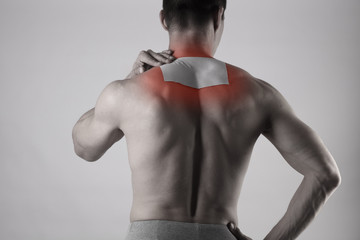 medicated pain relief patch, plaster. man with back pain. pain relief and health care concept isolat