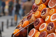 Pomegranate, Orange And Mandarine Cut Are Sold On The Streets Of Istanbul In A Fruit Shop