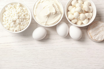 Wall Mural - Different dairy products on wooden table