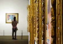 Girl Looks At A Painting At The Museum Of Art
