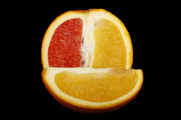 red and yellow orange slice isolated on black background