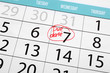 Due date written and circled in calendar, close up
