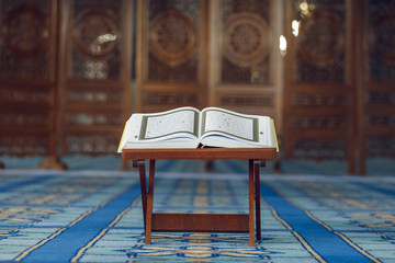 Quran - the holy islamic book on the lauh in the  mosque