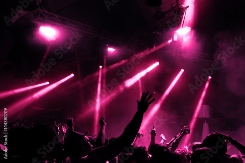 Cuadros en Lienzo Night club dj party people enjoy of music dancing sound with colorful light with Smoke Machine and lights show