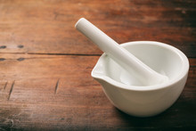 Mortar And Pestle On Wooden Background
