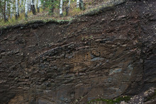 The Exposed Rock Layers In The Technogenic Canyon.