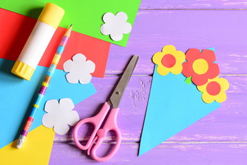 Wall Mural - Creating paper crafts for mother's day or birthday. Step. Tutorial. Paper bouquet gift for mommy. Scissors, glue stick, flowers templates, pencil on a table. Easy kids crafts idea. Top view