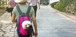 © creativefamily - Cute dog peeking from carrying backpack