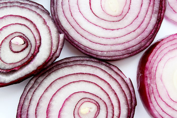 red onion sliced slices slices a few cloves closeup isolate...