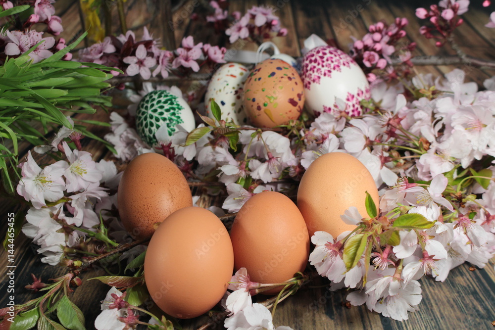 Painted Easter eggs and grass with cherry branch/ Easter eggs and ...