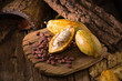 Cacao fruit, raw cacao beans, Cocoa pod on wooden background